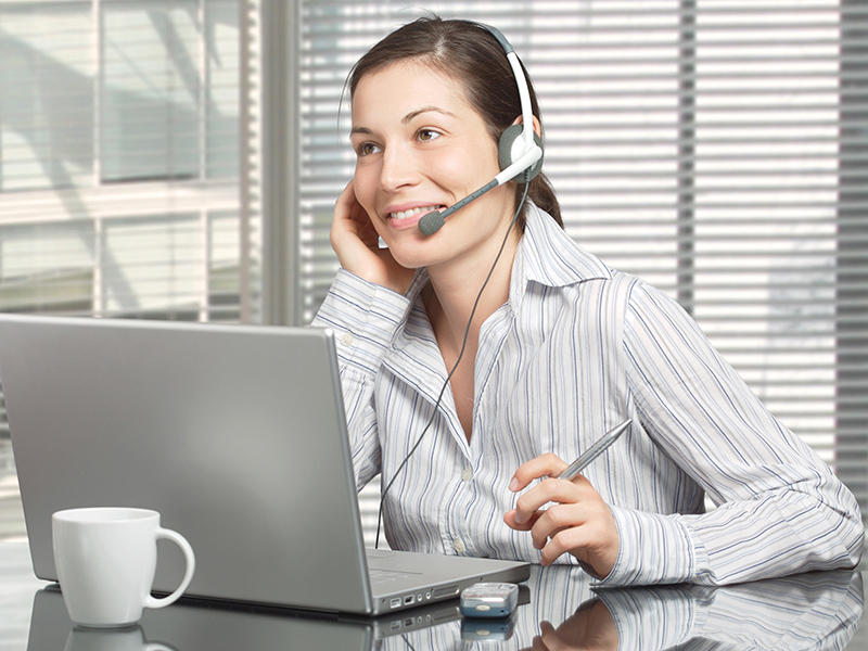 Person using headset and computer